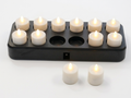 Rechargeable tea light set on white background in charging base
