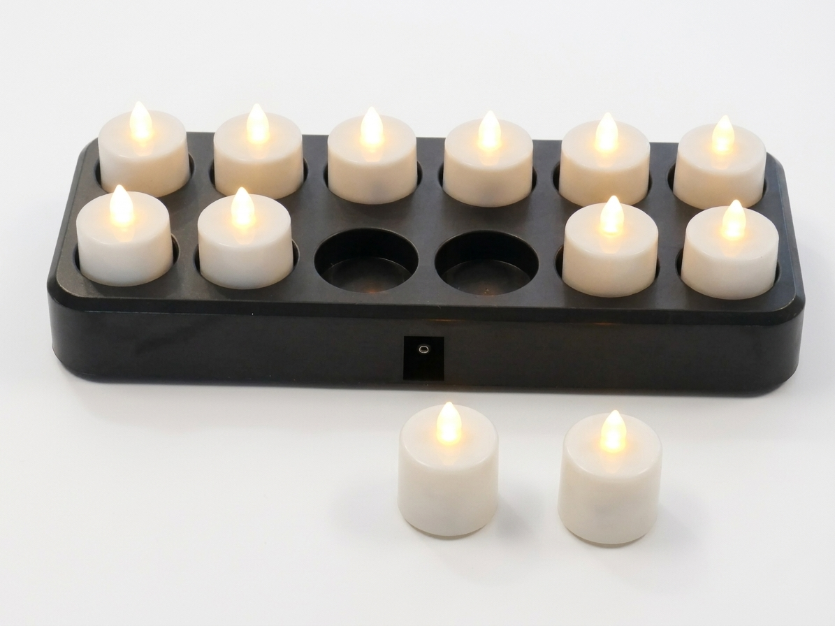 Rechargeable tea light set on white background in charging base